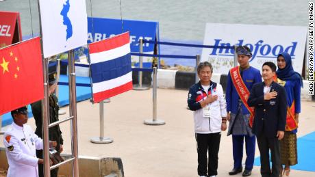 The flag of gold medalists Unified Korea is displayed next to silver medalists China and bronze medalists Thailand during the medals ceremony.