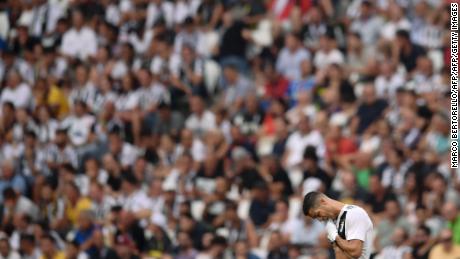 Juventus' Cristiano Ronaldo wipes his face during Juventus' Serie A match against Lazio on Saturday.