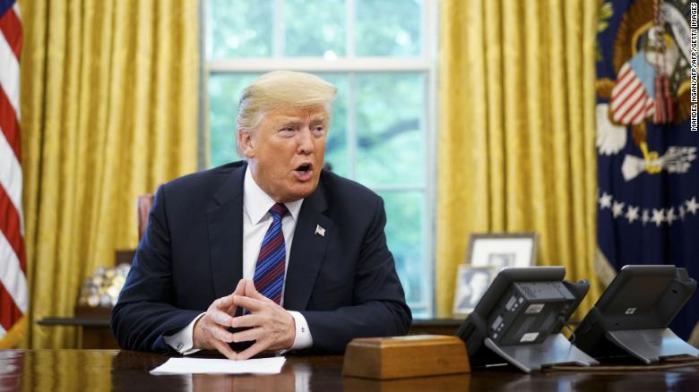 US President Donald Trump speaks on the phone with Mexico&#39;s President Enrique Pena Nieto on trade in the Oval Office of the White House in Washington, DC on August 27.