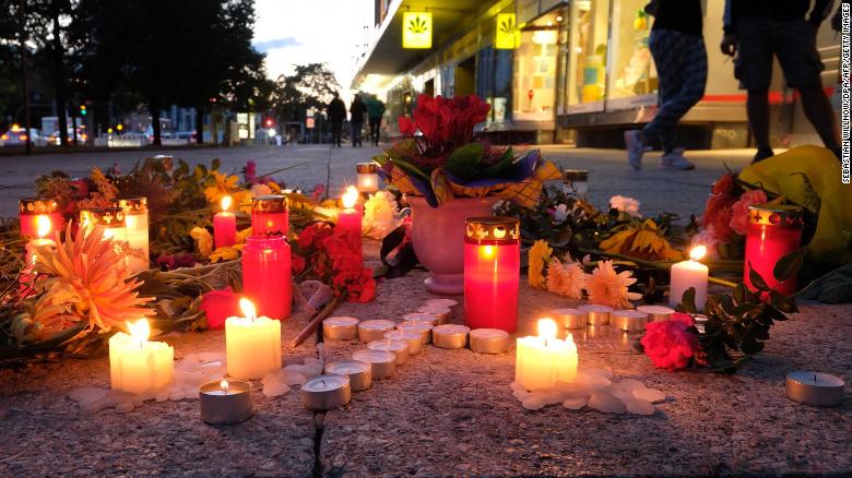 People display candles near the scene of the attack on the 35-year-old man, named by police only as Daniel H.