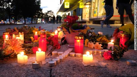 People display candles near the scene of the attack on the 35-year-old man, named by police only as Daniel H.