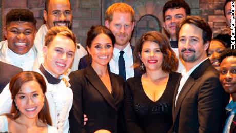 (L-R) Meghan, Duchess of Sussex (C), Prince Harry, Duke of Sussex, Vanessa Nadal, and playwright Lin Manuel Miranda meet the cast and crew of "Hamilton" backstage.