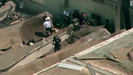 The roof of the plant rests on the ground after Thursday's collapse.