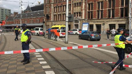 Security officials cordon off an area outside the central railway station in Amsterdam.