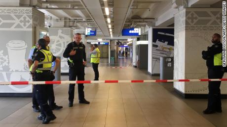 Security officials cordon off an area inside Amsterdam&#39;s central railway station Friday after the stabbings.