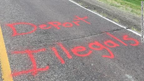 The spray-painted message appeared on the road Thursday.