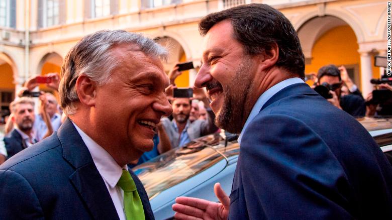 Italy&#39;s Interior Minister Matteo Salvini (R) embraces Hungary&#39;s Prime Minister Viktor Orban ahead of a meeting in Milan on August 28, 2018.