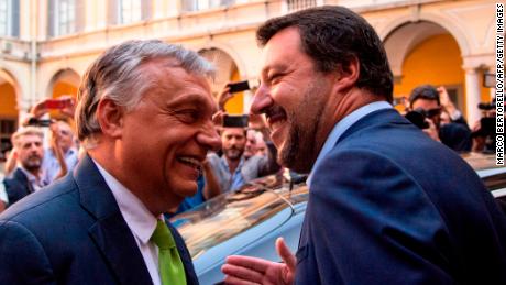 Italy&#39;s Interior Minister Matteo Salvini (R) embraces Hungary&#39;s Prime Minister Viktor Orban ahead of a meeting in Milan on August 28, 2018.