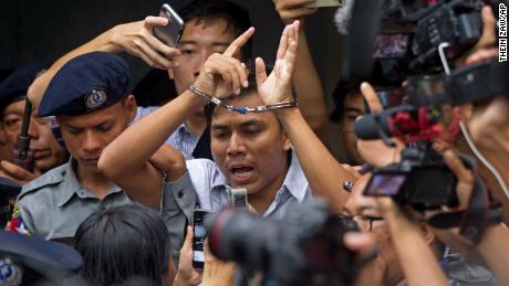 Kyaw Soe Oo speaks to journalists as he leaves court on Monday. 