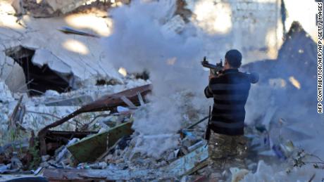 A member of the self-styled Libyan National Army, loyal to Khalifa Haftar, fires a rocket in Benghazi on November 9, 2017.