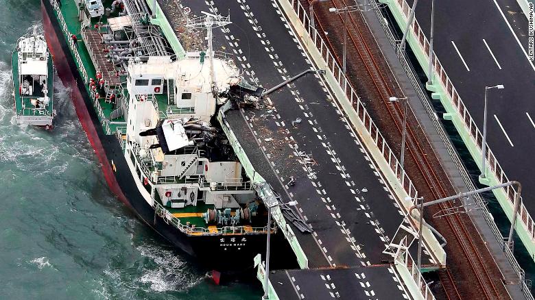 A tanker rests after slamming into the side of an Osaka bridge that connects the airport to the mainland, damaging part of the bridge and the vessel.