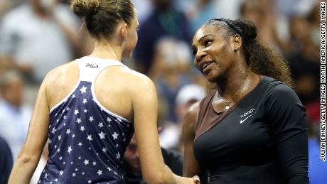 Williams and Pliskova shake hands following their match.