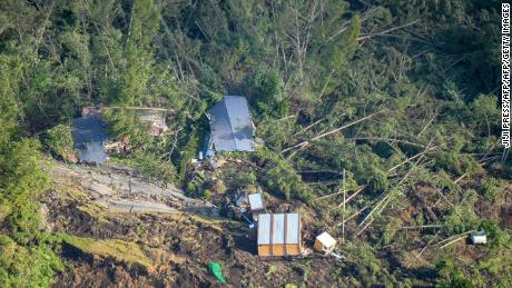 This picture shows an aerial view of houses damaged by a landslide in Atsuma town, Hokkaido prefecture on September 6, 2018, after an earthquake hit the northern Japanese island of Hokkaido.