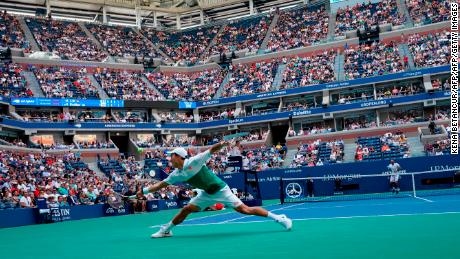 Nishikori stretches for a return during his quarterfinal match against Marin Cilic.