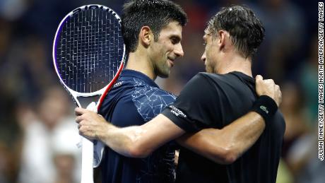 Djokovic consoles Millman after beating him to advance to the semifinals of the 2018 US Open.