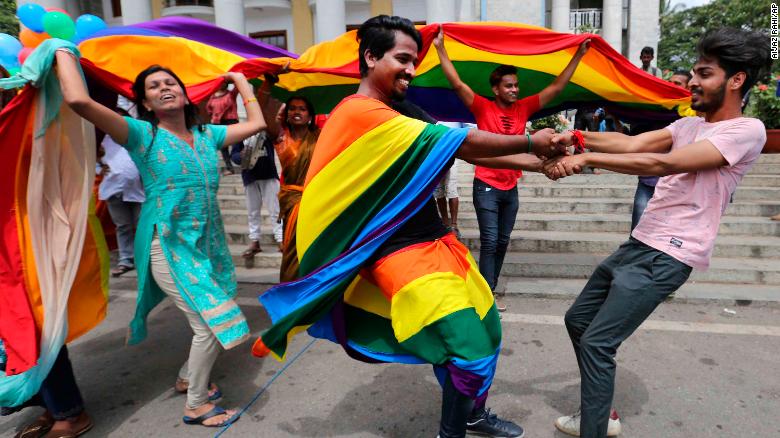 Members of India's LGBT community dance in celebration after the ruling was announced in Bangalore on Thursday.