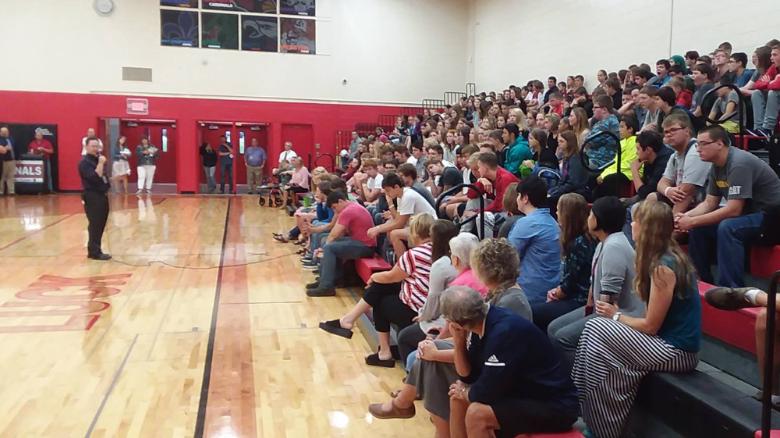 Luck High School principal Brad Werner talks to students on their first day of school. He announced a scholarship for every graduating senior to go to technical school.