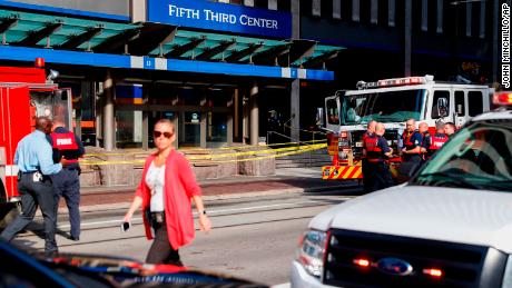 Emergency personnel and police respond to a reported active shooter situation near Fountain Square on Thursday.