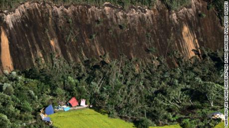 ATSUMA, JAPAN - SEPTEMBER 06:  (CHINA OUT, SOUTH KOREA OUT) In this aerial image, houses are buried by multiple landslides after a powerful earthquake at Yoshino district on September 6, 2018 in Atsuma, Hokkaido, Japan. The magnitude 6.7 strong earthquake, struck 3:08 am, causes landslides, 3 million households in Hokkaido suffer a blackout.  (Photo by The Asahi Shimbun via Getty Images)