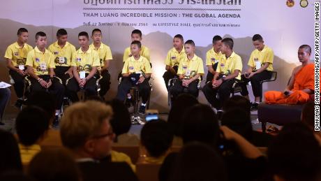 Thai boys trapped in cave meet divers at event telling of trials