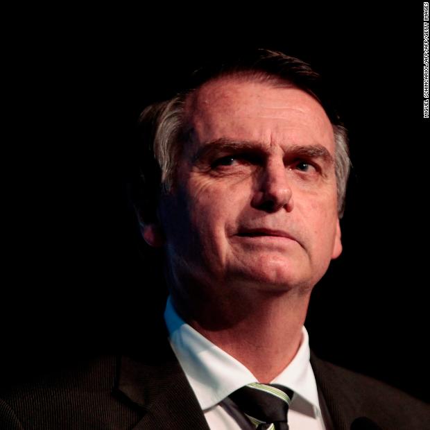 The Brazilian presidential candidate for the Social Liberal Party, Jair Bolsonaro, gestures during the Brazilian Sugarcane Industry Association&#39;s Unica Forum 2018 in Sao Paulo, Brazil, on June 18, 2018. - Brazil holds general elections in October. (Photo by Miguel SCHINCARIOL / AFP) (Photo credit should read MIGUEL SCHINCARIOL/AFP/Getty Images)