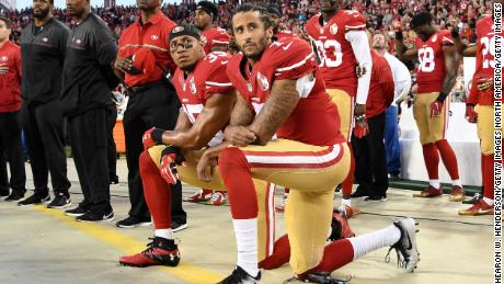 Colin Kaepernick (right) and Eric Reid of the San Francisco 49ers kneel during the national anthem in 2016.  