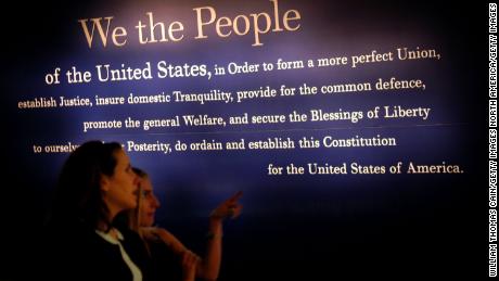 PHILADELPHIA - JULY 1: Two women walk past a painting of the beginning of the U.S. Constitution during a preview of the National Constitution Center July 1, 2003 in Philadelphia, Pennsylvania. The National Constitution Center will be the only museum in the U.S. dedicated to honoring and explaining the U.S. Constitution. Supreme Court Justice Sandra Day O&#39;Connor will receive the Philadelphia Liberty Medal at the NCC&#39;s grand opening on July 4, 2003.  (Photo by William Thomas Cain/Getty Images)