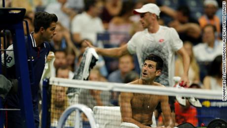 Novak Djokovic stayed in court while John Millman of Australia left the pitch to change his shirt due to the humidity during a US Open Men's singles quarter-finals match on Wednesday.