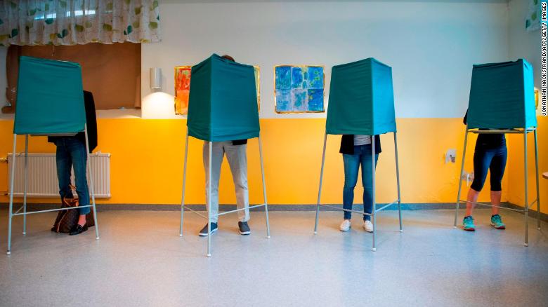 Voters marking their choices a polling station in Stockholm on Sunday. 