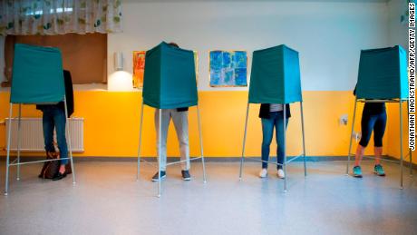 Voters marking their choices a polling station in Stockholm on Sunday. 