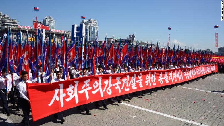 North Koreans march in Kim Il Sung Square as part of Sunday&#39;s civilian parade.