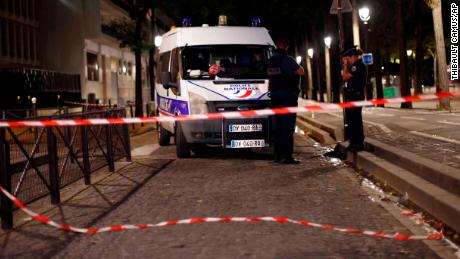 Police officers secure the site of the knife attack Monday in Paris. 