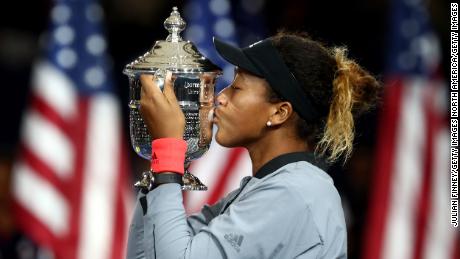 NEW YORK, NY - SEPTEMBER 08: Naomi Osaka of Japan poses with the championship trophy after winning the Women's Singles finals match against Serena Williams of the United States on Day Thirteen of the 2018 US Open at the USTA Billie Jean King National Tennis Center on September 8, 2018 in the Flushing neighborhood of the Queens borough of New York City. (Photo by Julian Finney/Getty Images)