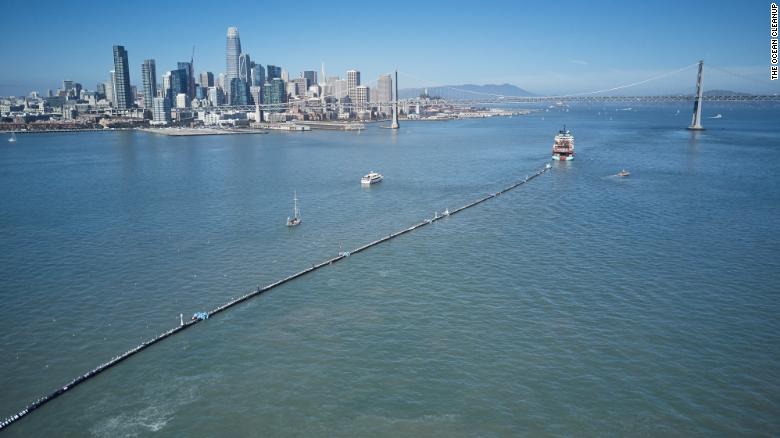 A boat tows the Ocean Cleanup System 001 from San Francisco on Saturday.