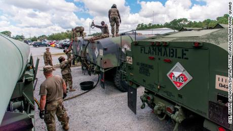 South Carolina National Guard soldiers from the 118th Forward Support Company transfer fuel to tankers. The Guard has been called out to assist civilians affected by Hurricane Florence.