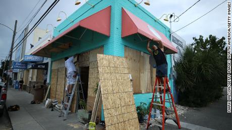 WRIGHTVILLE BEACH, NC - SEPTEMBER 11:  Workers board up the Wrightsville Beach Art Co. while preparing for the arrival of Hurricane Florence on September 11, 2018 in Wrightsville Beach, United States. Hurricane Florence is expected on Friday possibly as a category 4 storm along the Virginia, North Carolina and South Carolina coastline.  (Photo by Mark Wilson/Getty Images)