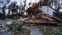 065106 02: A man stands in a partially destroyed house September 27, 1989 in South Carolina. Hugo is ranked as the eleventh most intense hurricane to strike the US this century and is rated the second costliest with over seven billion dollars in damages. (Photo by Alan Weiner/Liaison)