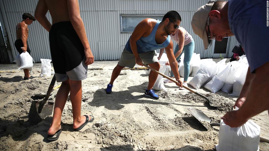 People fill sandbags in Wrightsville Beach, North Carolina, on September 11.