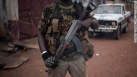 An armed militiaman stands guard in the majority Muslim district of Bangui, Central African Republic.