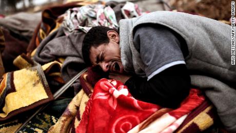 West Mosul residents mourn relatives killed by an airstrike targeting ISIS jihadists. Iraq was named the world&#39;s second-most negative country in Gallup&#39;s annual Global Emotions Report.