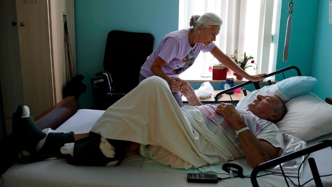 Marge Brown says goodbye to her father, George Brown, before his evacuation from a health care home in Morehead City, North Carolina, on September 12.