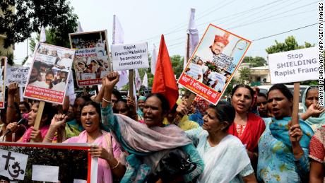 Indian women hold placards and chant slogans during a September 2018 protest march to demand the immediate arrest of Roman Catholic church Bishop Franco Mulakkal, who is accused of raping a nun.
