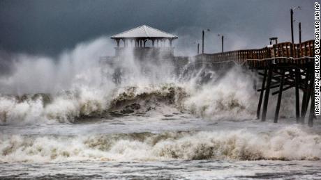Waves crash around Oceanana Pier in Atlantic Beach, North Carolina, as the outer bands of Hurricane Florence begin to affect the coast on Thursday, September 13.