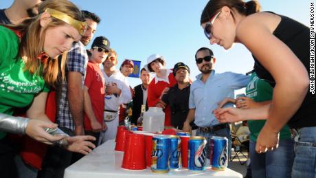 Notre Dame fans play "flip cup" before watching their team play.