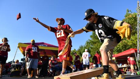 Fans play cornhole before a 2016 Pittsburgh Steelers-Washington Redskins game at FedEx Field in Landover, Maryland.