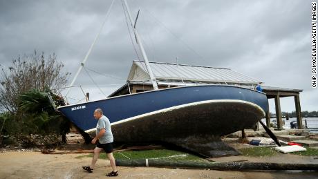 A sail boat lifted by the storm surge leans against a building at the destroyed Bridgepointe Marina a day after Hurricane Florence made landfall September 15, 2018 in New Bern, North Carolina.