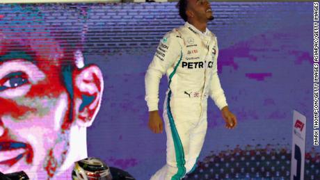 Lewis Hamilton celebrates after his brilliant victory in the Singapore Grand Prix.