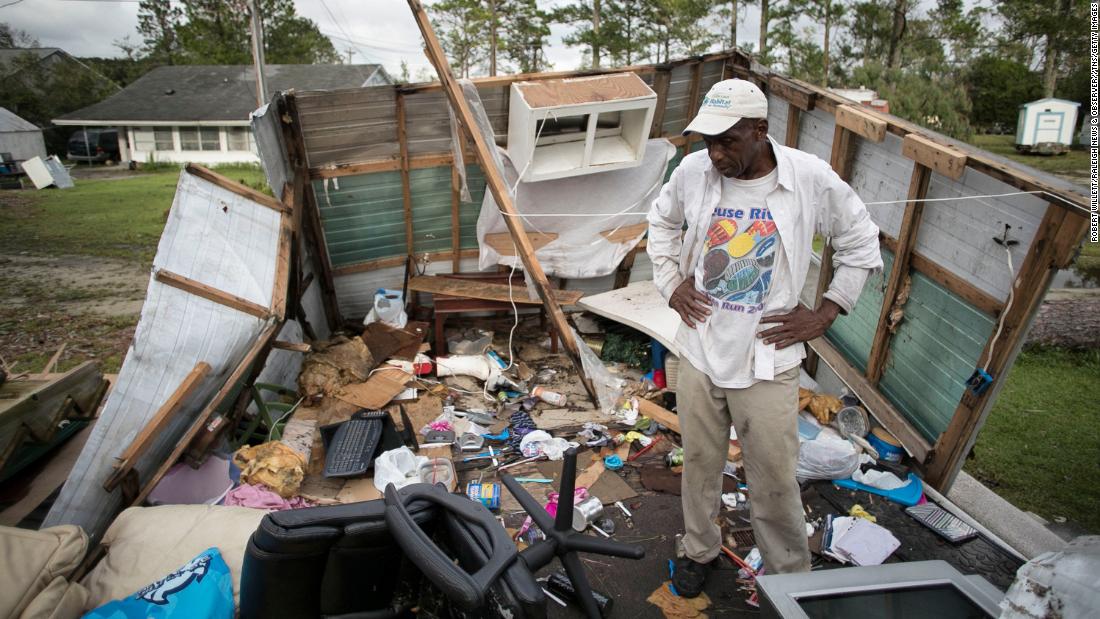 Tony Thompson stands in the wreckage of his mobile home as Florence moved inland over Newport, North Carolina, on September 16.