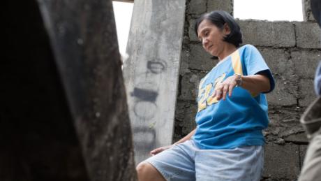 Rosebin Martin of Buguey in northern Luzon checks on damage caused by Super Typhoon Mangkhut.