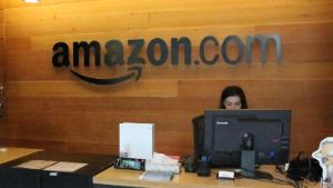 Nikol Szymul staffs a reception desk at Amazon offices discretely tucked into a building called Fiona in downtown Seattle, Washington on May 11, 2017. 
Online retail powerhouse Amazon is constructing an eye-catching Spheres office building to feature waterfalls, tropical gardens and other links to nature as part of its urban campus in Seattle, Washington.  / AFP PHOTO / Glenn CHAPMAN        (Photo credit should read GLENN CHAPMAN/AFP/Getty Images)